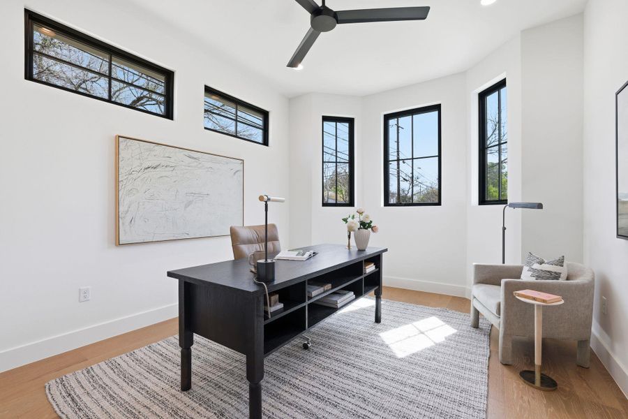 Office space featuring light wood-style flooring and ceiling fan