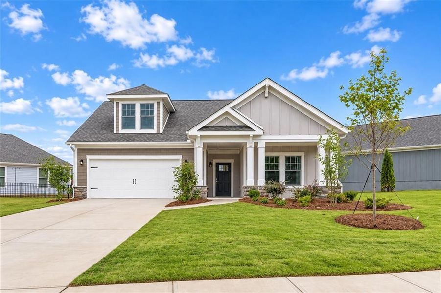 Front exterior of a new home in The Courtyards at Bailey Farms, Dacula, GA, highlighting curb appeal (Image 23).