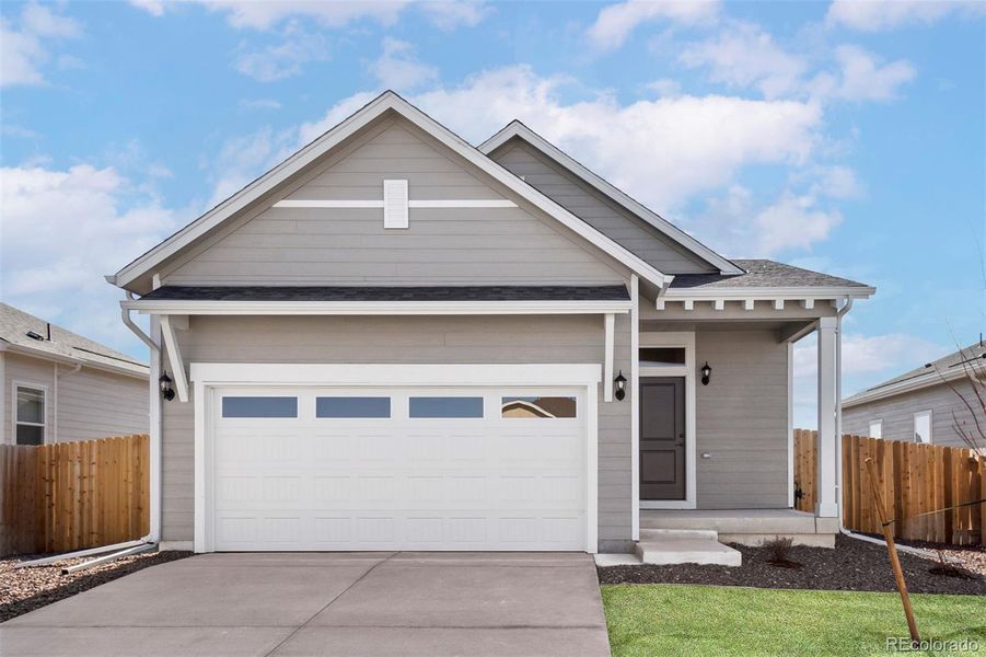 Front exterior of a new home in Second Creek Farm, Commerce City, CO, highlighting curb appeal (Image 1).