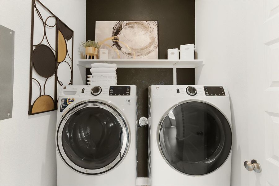 Laundry room with separate washer and dryer and electric panel Laundry room with separate washer and dryer and electric panel