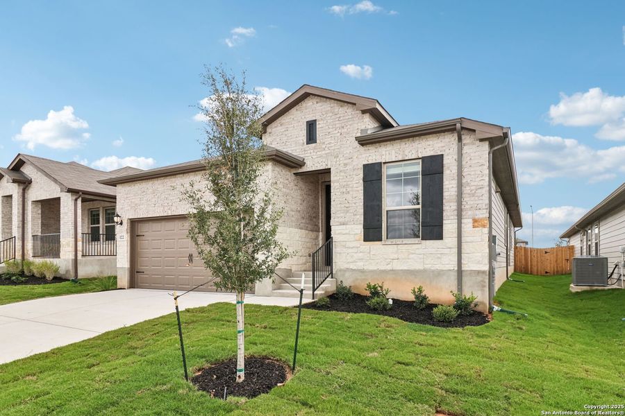 Front exterior of a new home in Legendary Trails - Premier Series, Cibolo, TX, highlighting curb appeal (Image 20).
