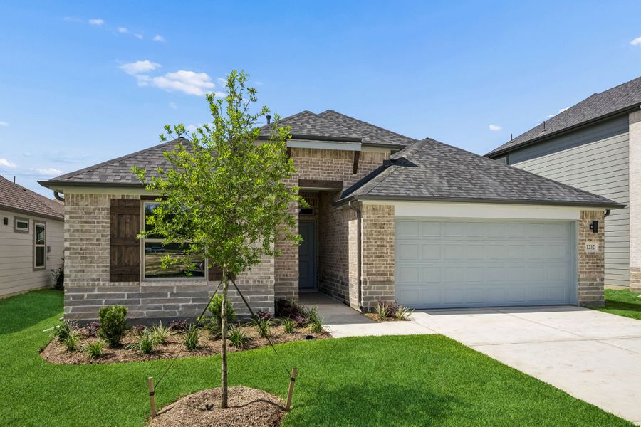 Front exterior of a new home in Riviera Pines, Huffman, TX, highlighting curb appeal (Image 18). Front exterior of a new home in Riviera Pines, Huffman, TX, highlighting curb appeal (Image 18).