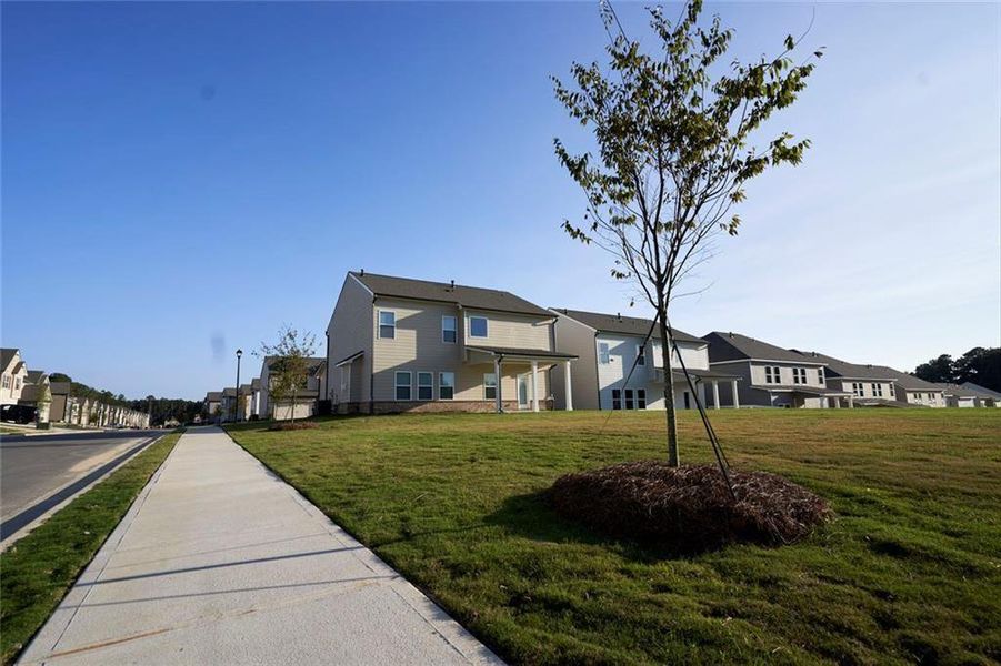 Front exterior of a new home in Westgate Estates, Loganville, GA, highlighting curb appeal (Image 20).