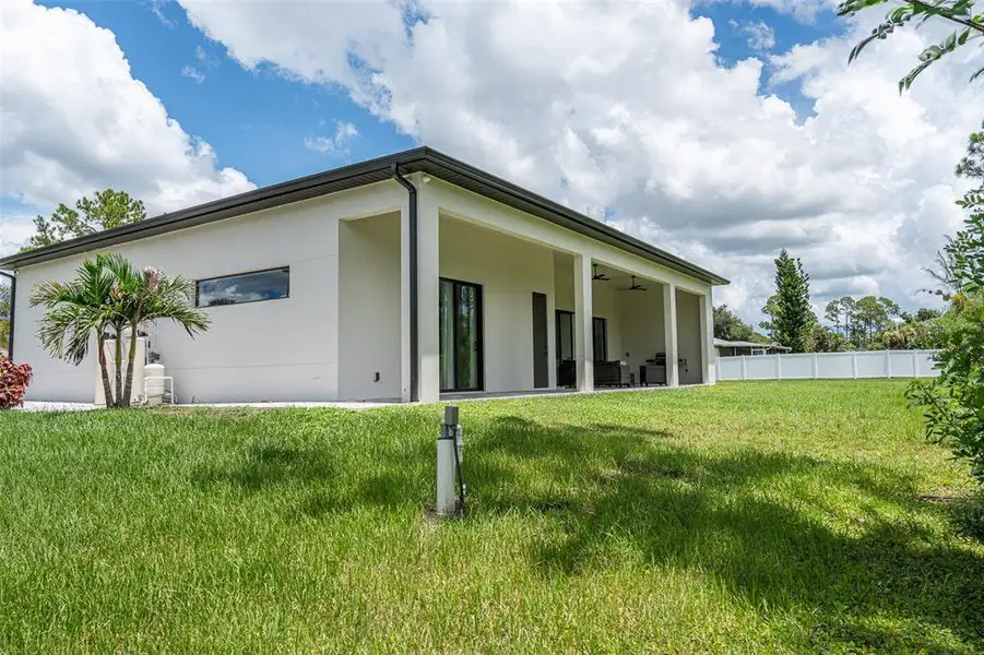 Exterior details and patio area of a home in , North Port (Image 29).