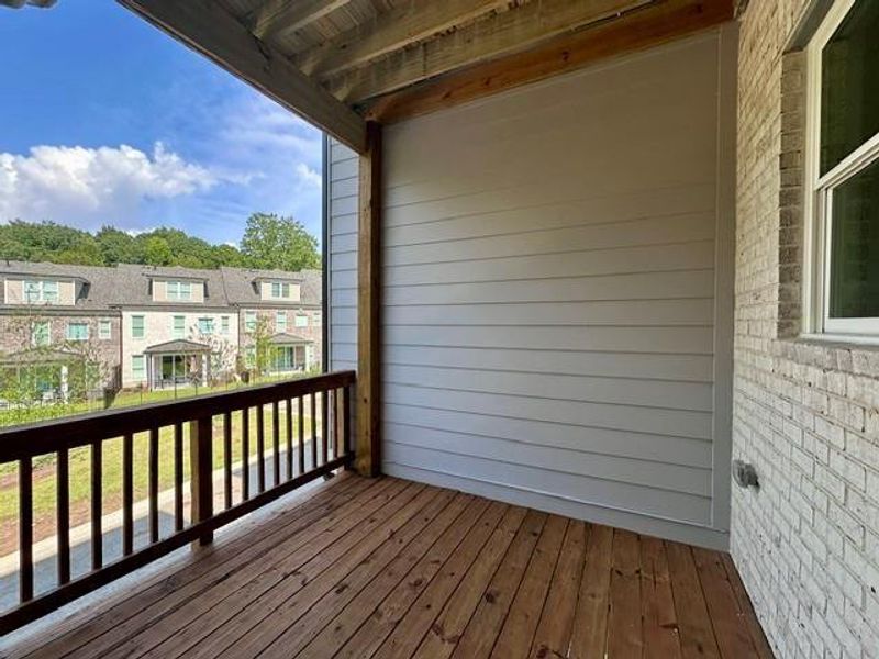 Exterior details and patio area of a home in Ward's Crossing Townhomes, Johns Creek (Image 25).