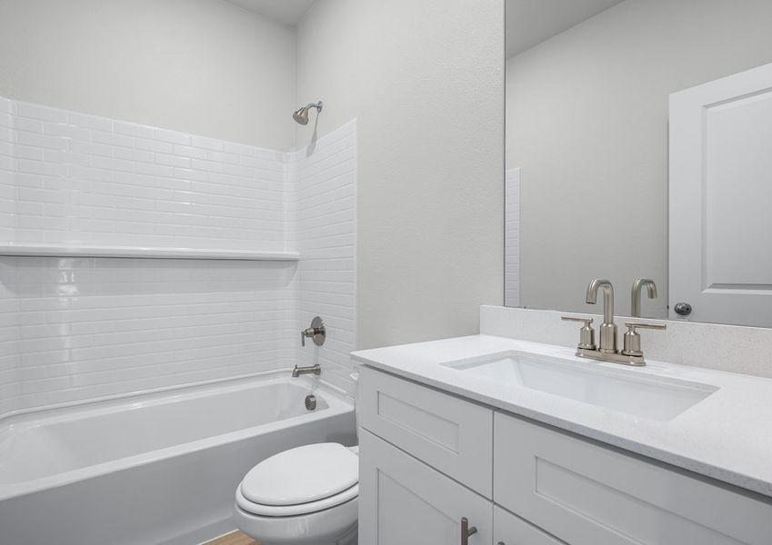 Bathroom with a white vanity and shower/tub combo