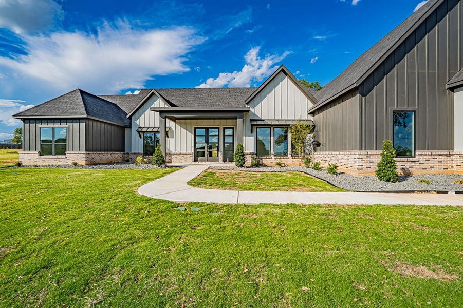Front exterior of a new home in , Granbury, TX, highlighting curb appeal (Image 2). Front exterior of a new home in , Granbury, TX, highlighting curb appeal (Image 2).