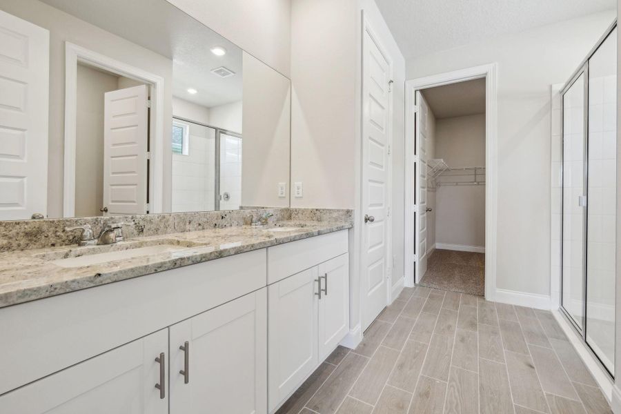 Front exterior of a new home in Brystol at Wylder - Reserve Series, Port St. Lucie, FL, highlighting curb appeal (Image 1).