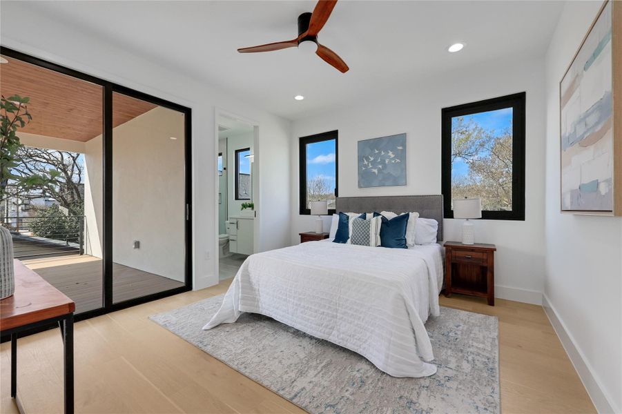 Bedroom with light wood-type flooring, multiple windows, a ceiling fan, access to outside, and recessed lighting