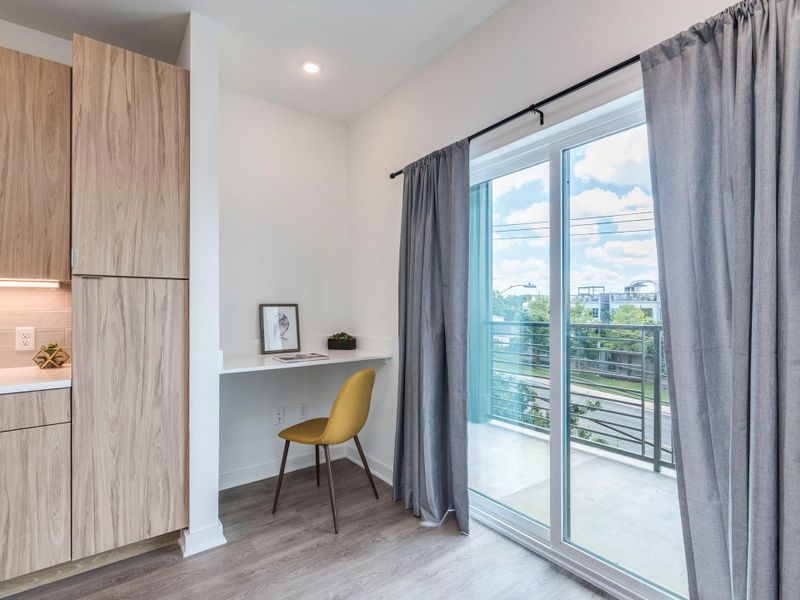 This condo features a built in study area, light wood finished floors, and recessed lighting This condo features a built in study area, light wood finished floors, and recessed lighting