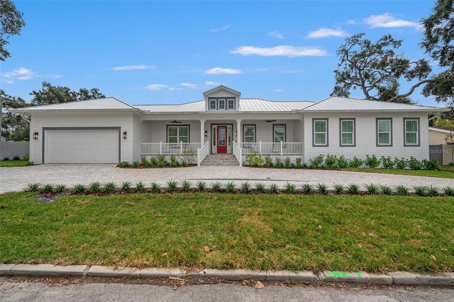Front exterior of a new home in , Tampa, FL, highlighting curb appeal (Image 1). Front exterior of a new home in , Tampa, FL, highlighting curb appeal (Image 1).
