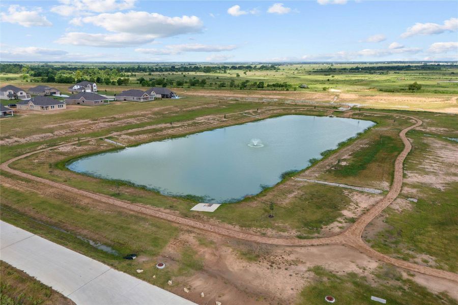 Take a relaxing walk around the community pond.