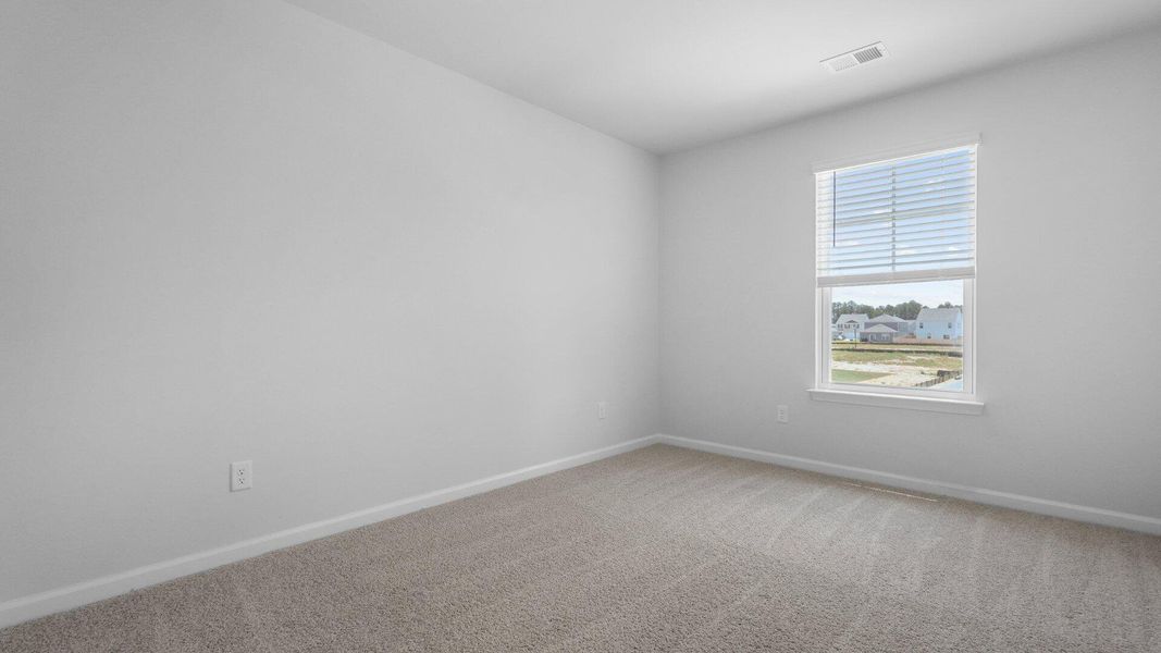 Spacious, unfurnished interior of a new home in Pine Hills at Cane Bay, Summerville (Image 15).