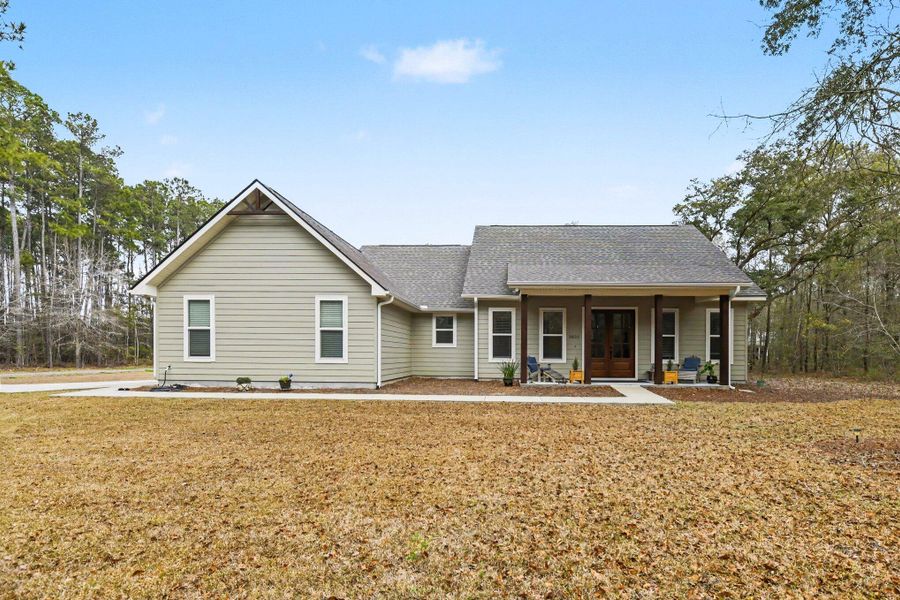 Exterior details and patio area of a home in , Johns Island (Image 19).