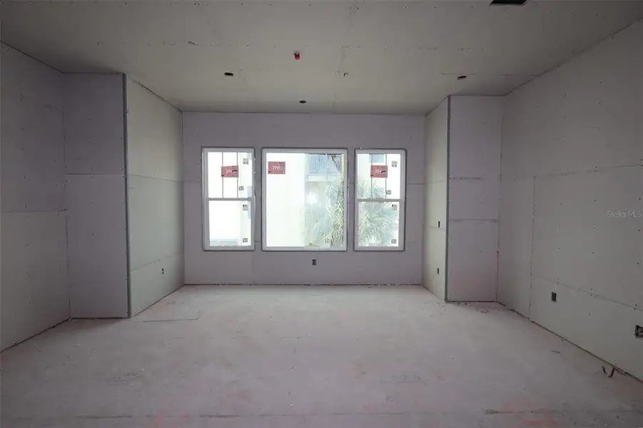 In-progress construction of a new home in Towns at Union, St. Petersburg, FL (Image 16).