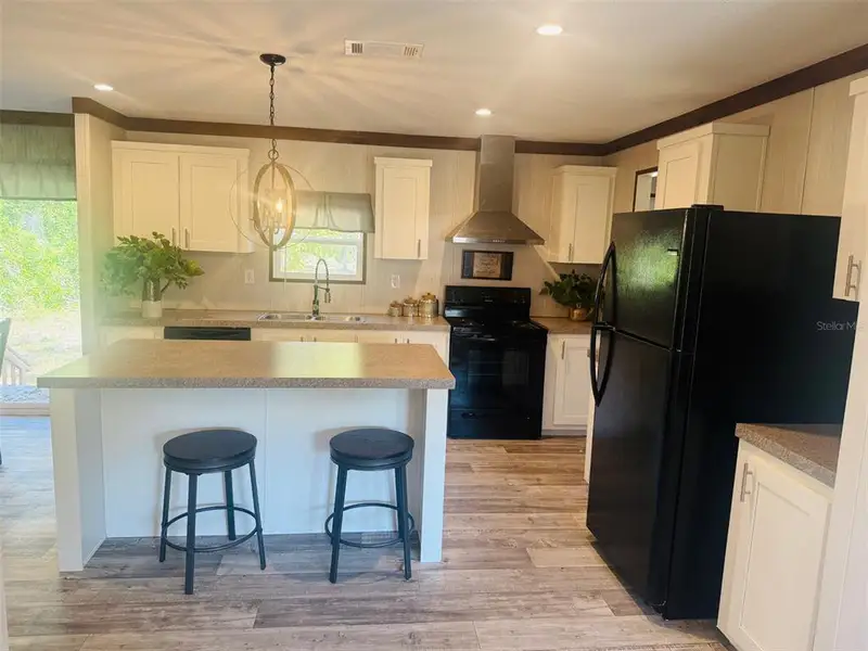 Furnished interior view inside a new home in , Fort White (Image 12).