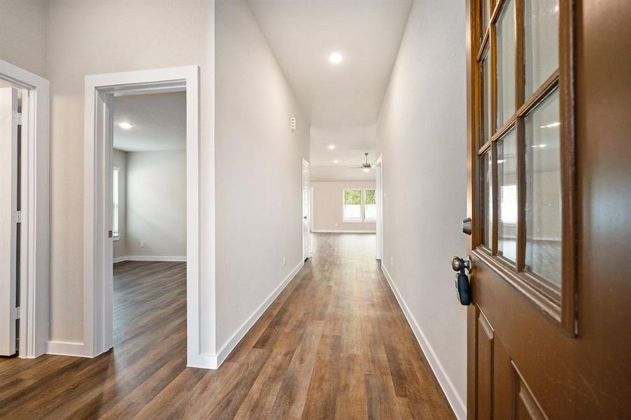 As you enter the home, a long hallway aways with plenty of options to decorate your space