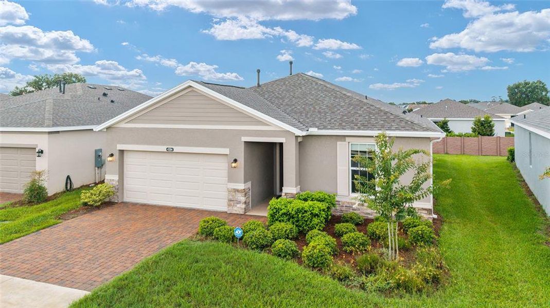 Front exterior of a new home in Ocala Preserve, Ocala, FL, highlighting curb appeal (Image 21).