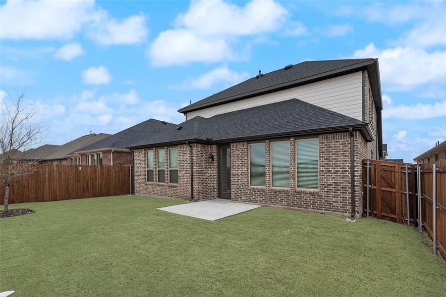 Exterior details and patio area of a home in Walden Pond, Forney (Image 3).