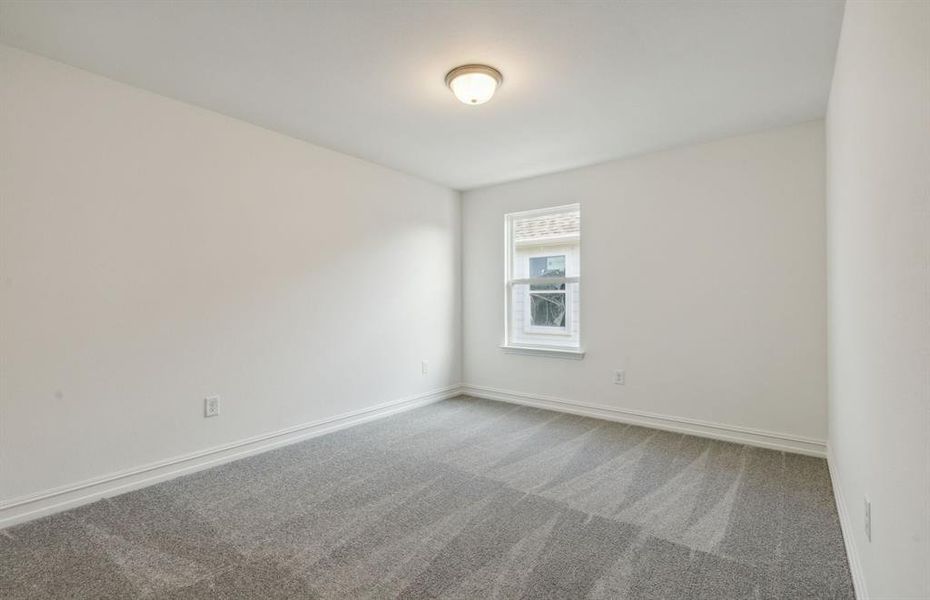 Spacious secondary bedroom with ample closet space *real home pictured