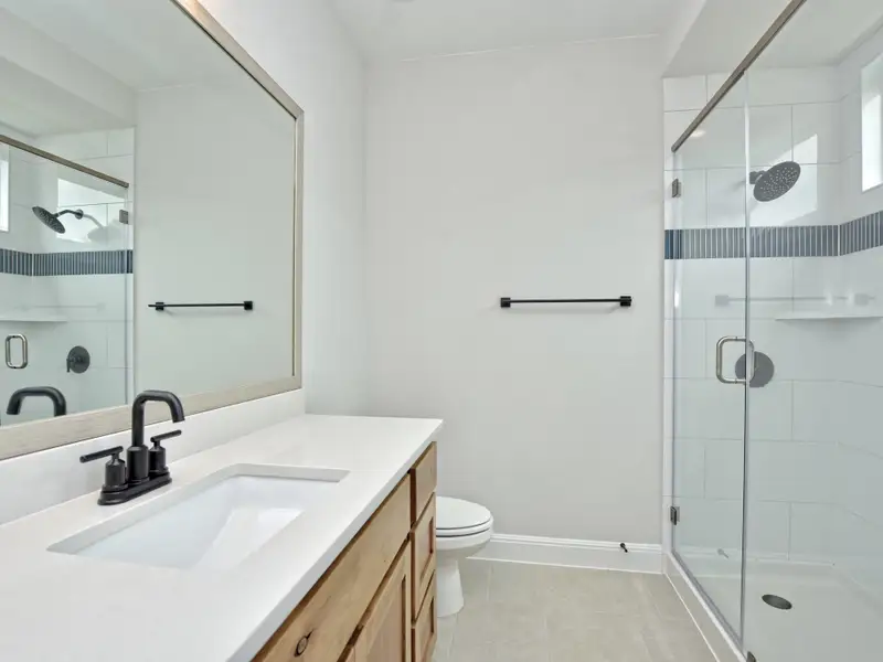 Representative furnished interior of a home built from the Santa Barbara II by Giddens Homes in Scofield Farms Estates, Georgetown (Image 83).