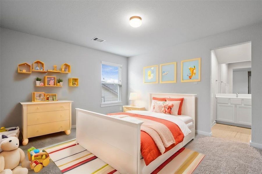 Secondary bedroom features plush carpet, custom paint, high ceilings, and a large window with privacy blinds. This bedroom has a jack and jill bathroom with another secondary bedroom.