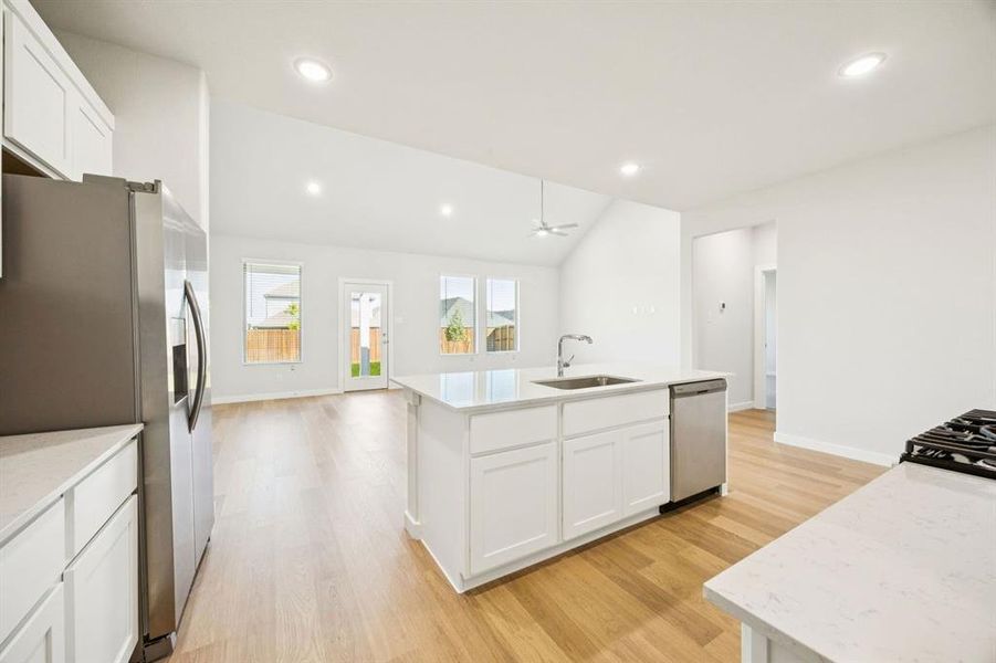 Kitchen in the Masters home plan by Trophy Signature Homes – REPRESENTATIVE PHOTO