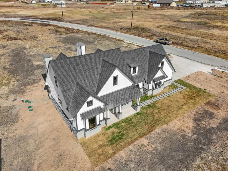 Newly constructed residence boasts a striking facade and ample grounds, perfect for future landscaping. Newly constructed residence boasts a striking facade and ample grounds, perfect for future landscaping.