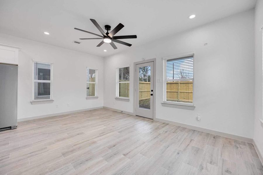 Glass door leading to the backyard allows easy indoor-outdoor living and plenty of natural sunlight to fill the living area.