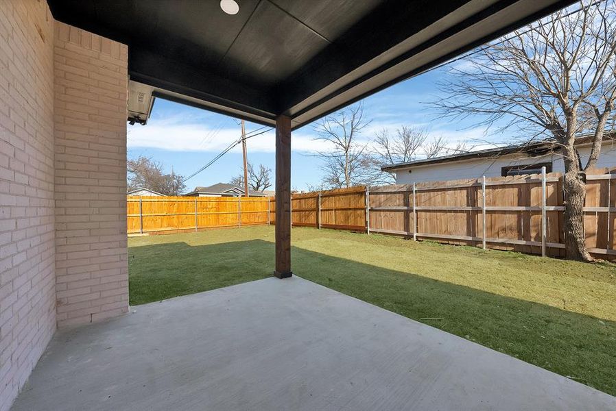 Fenced backyard featuring a patio area