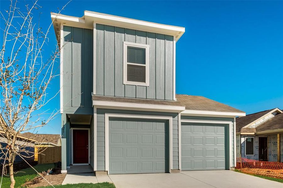 View of front of home featuring a garage