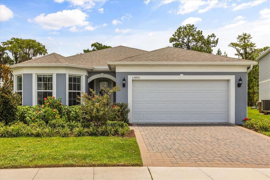 Front exterior of a new home in , Clermont, FL, highlighting curb appeal (Image 2). Front exterior of a new home in , Clermont, FL, highlighting curb appeal (Image 2).