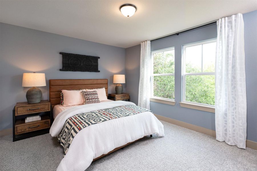 Your secondary bedroom features plush carpet, fresh paint, closet, and a large window that lets in plenty of natural lighting.