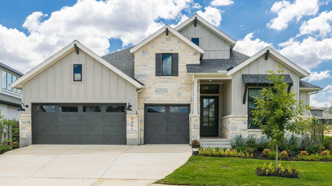 View of front of house with board and batten siding, roof with shingles, stone siding, and concrete driveway View of front of house with board and batten siding, roof with shingles, stone siding, and concrete driveway