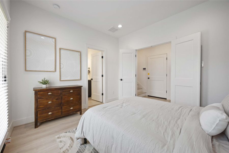 First floor secondary bedroom with en-suite full bath. Photo of the model home (finishes and specifications may vary)