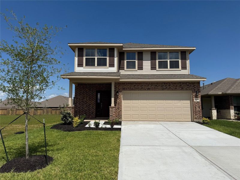 Front exterior of a new home in Bayou Maison, Dickinson, TX, highlighting curb appeal (Image 2). Front exterior of a new home in Bayou Maison, Dickinson, TX, highlighting curb appeal (Image 2).