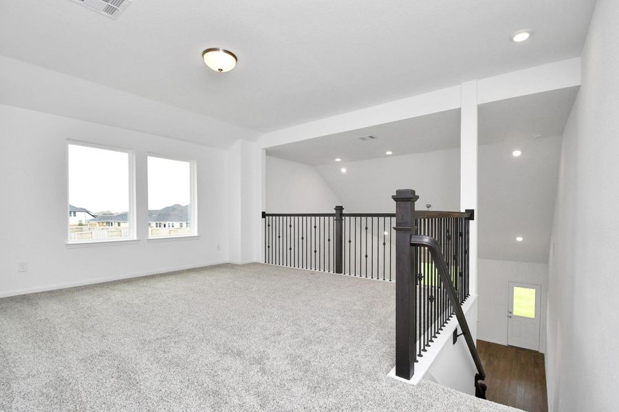 Spacious, unfurnished interior of a new home in Sunterra, Katy (Image 22).