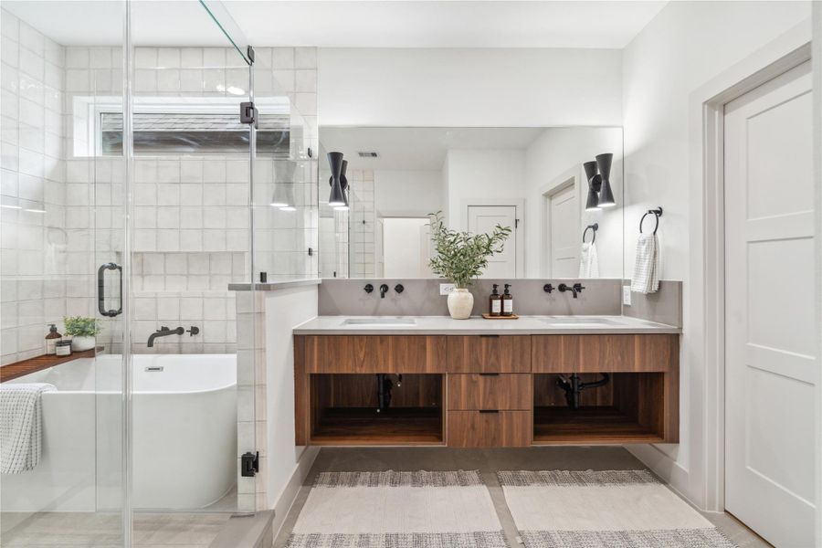 A spa-worthy retreat in your own home—this breathtaking en-suite blends luxury finishes, natural light, and a deep soaking tub for the ultimate place to unwind.