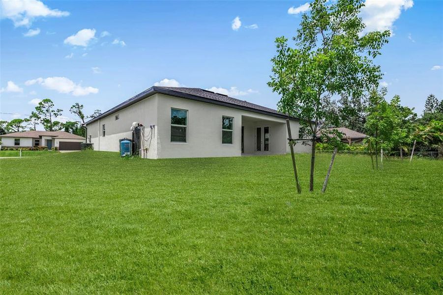 Front exterior of a new home in , North Port, FL, highlighting curb appeal (Image 27). Front exterior of a new home in , North Port, FL, highlighting curb appeal (Image 27).
