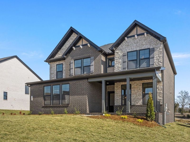 Front exterior of a new home in Benders Cove, Mount Juliet, TN, highlighting curb appeal (Image 2). Front exterior of a new home in Benders Cove, Mount Juliet, TN, highlighting curb appeal (Image 2).