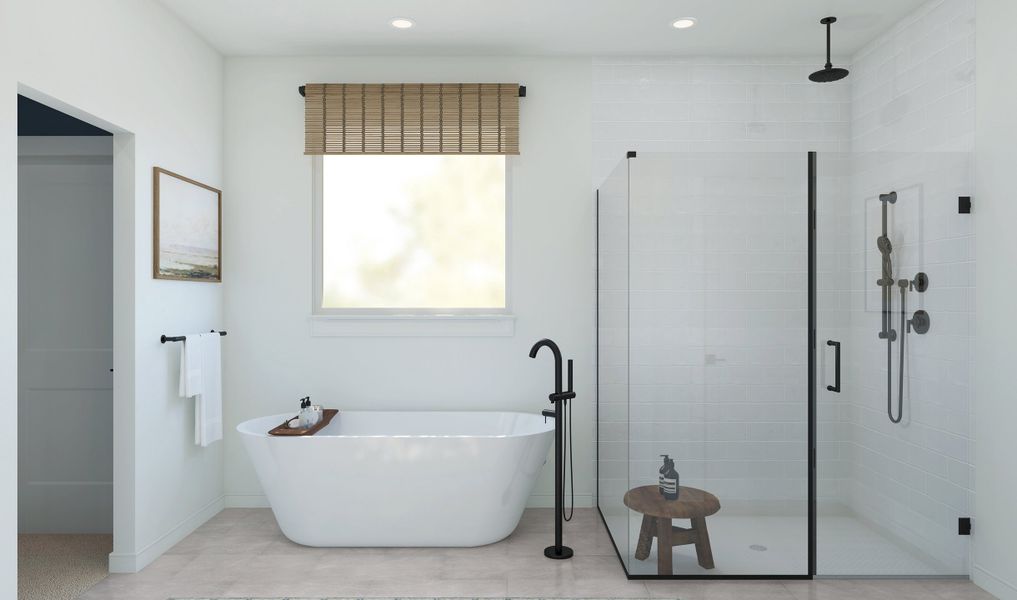 Primary bath with freestanding tub and glass shower enclosure