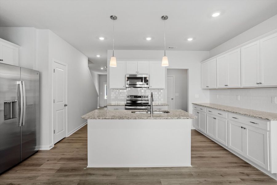 Furnished interior view inside a new home in West Main Townhomes, Sanford (Image 4).