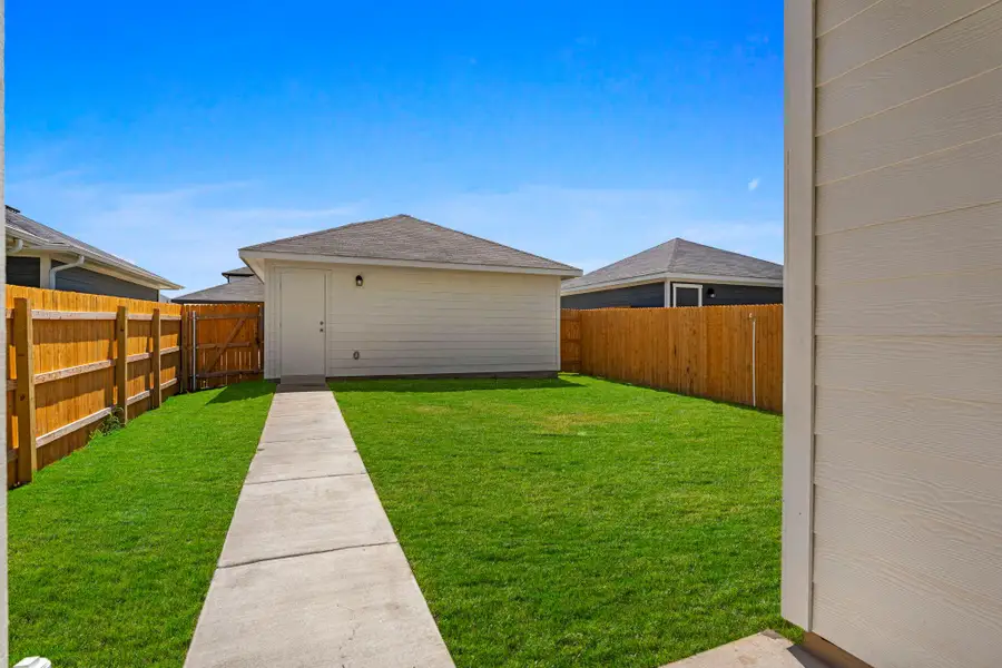 Exterior details and patio area of a home in Valverde, Bastrop (Image 19).