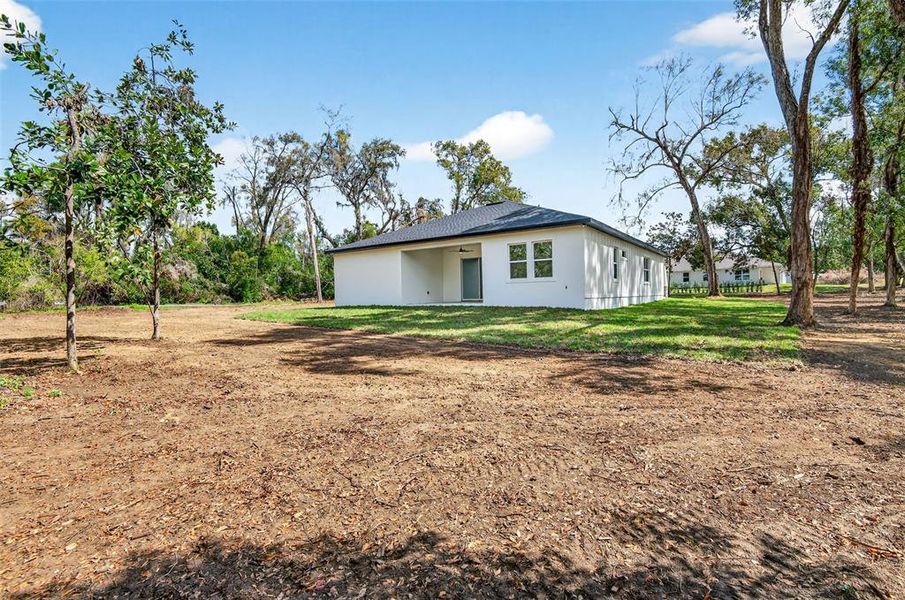 Exterior details and patio area of a home in , Dade City (Image 22).