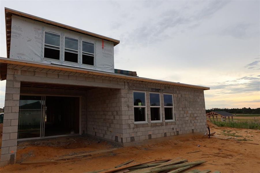 In-progress construction of a new home in Lake Star at Ovation, Winter Garden, FL (Image 8).