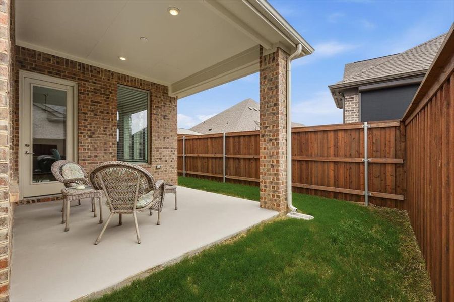 Exterior details and patio area of a home in Elements at Viridian | Active Adult 55+, Arlington (Image 21).