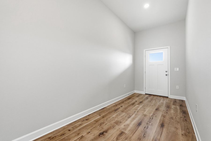 Photos of a similar home. Foyer