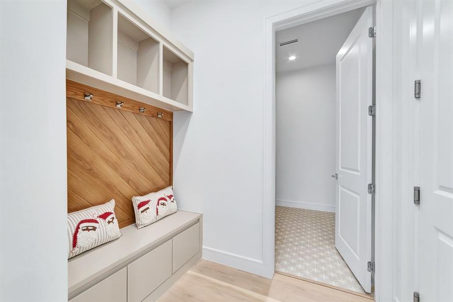 Mudroom with light wood-type flooring and baseboards Mudroom with light wood-type flooring and baseboards