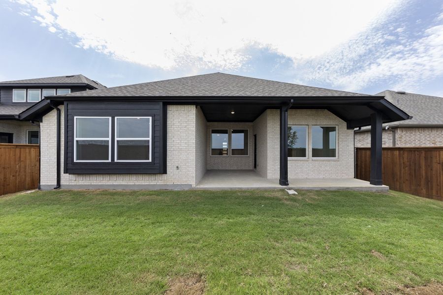 Exterior details and patio area of a home in Creekview Meadows, Pilot Point (Image 4).