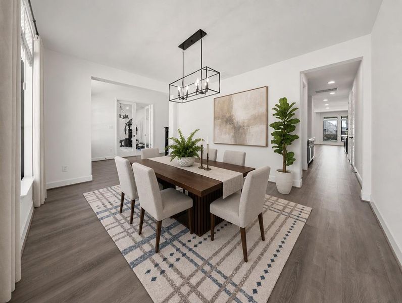 Elegant dining space boasts abundant natural light and an overhead linear chandelier. Elegant dining space boasts abundant natural light and an overhead linear chandelier.